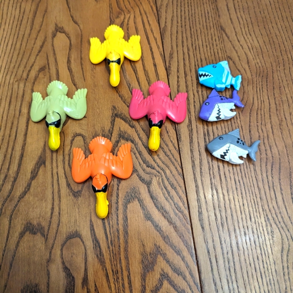 Diving toys. Pelicans and sharks. Could be used as bath tub or pool toys.  GUC